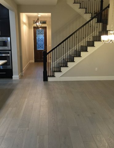 living room/dining room with hardwood floor Peoples Signature Flooring Austin Texas