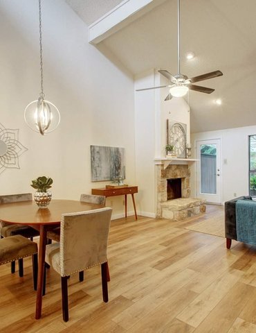 living room/dining room with hardwood floor Peoples Signature Flooring Austin Texas