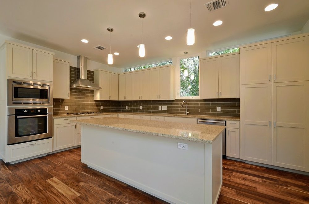 kitchen with hardwood floor Peoples Signature Flooring Austin Texas, Acacia Natural 5 Inch (Hand Sculpted)