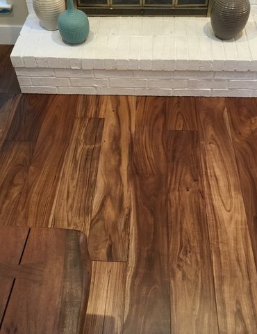 fireplace with hardwood floor Peoples Signature Flooring Austin Texas, 7.5 Inch Wide Hand Sculpted Acacia Natural 1x8 Baseboards