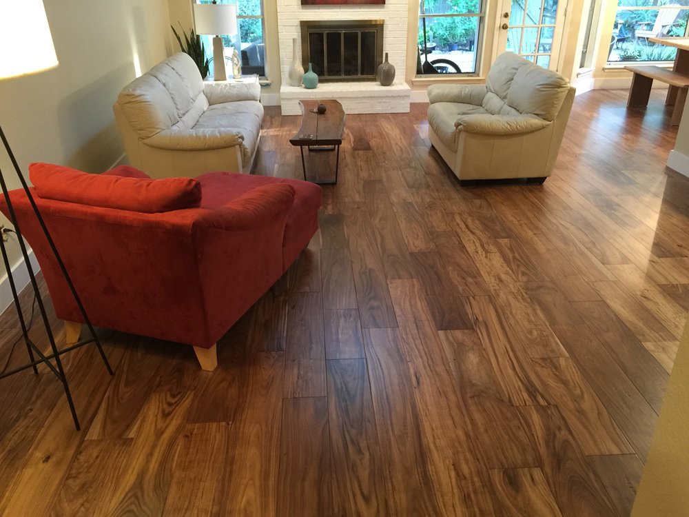 living room with hardwood floor Peoples Signature Flooring Austin Texas, 7.5 Inch Wide Hand Sculpted Acacia Natural 1x8 Baseboards