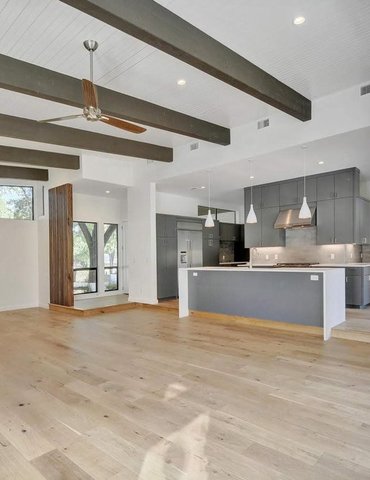 living room/dining room with hardwood floor Peoples Signature Flooring Austin Texas