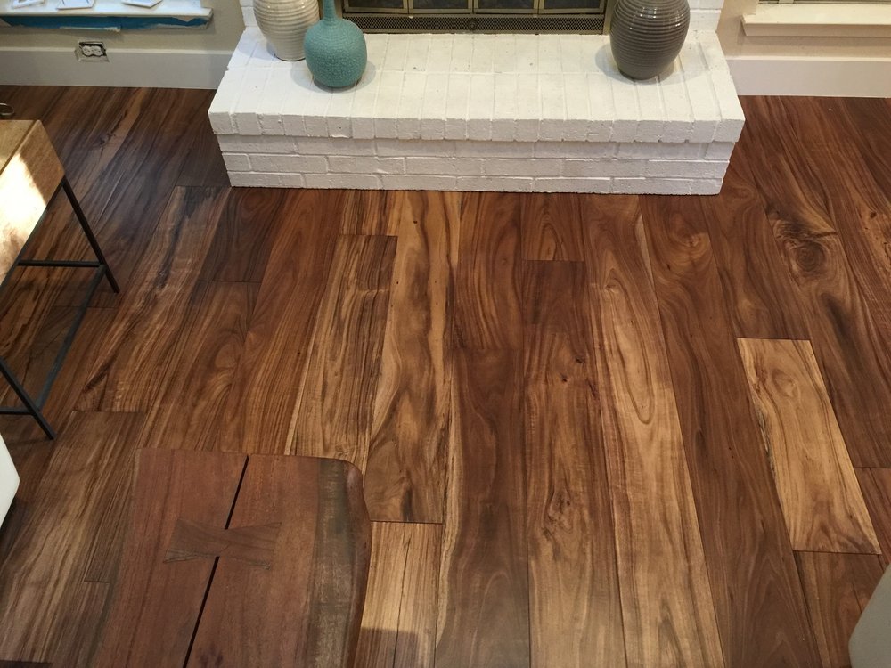 fireplace with hardwood floor Peoples Signature Flooring Austin Texas, 7.5 Inch Wide Hand Sculpted Acacia Natural 1x8 Baseboards