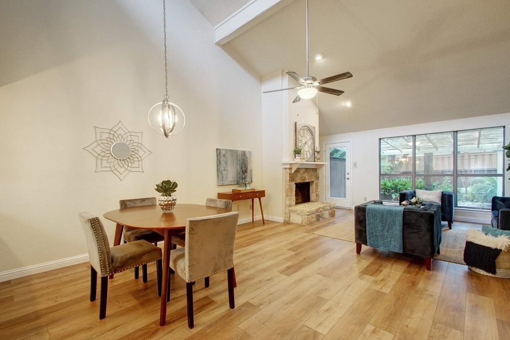 living room/dining room with hardwood floor Peoples Signature Flooring Austin Texas